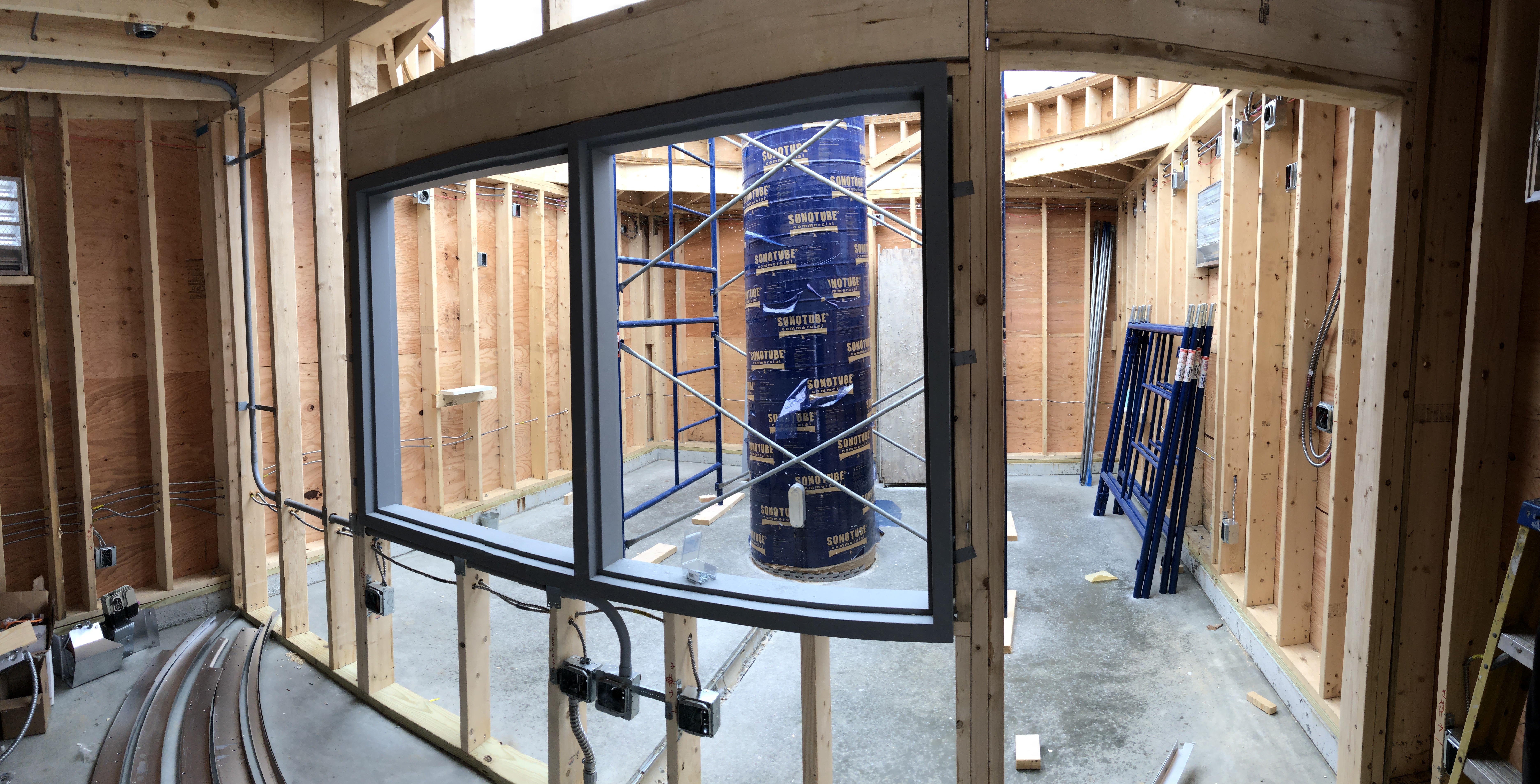 The view of the telescope room through the framed wall of the control room. The window casement has been installed along with initial conduit for electrical. network and telescope control lines. 