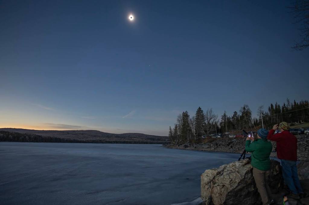 Wide field image during totality. Mr. DiCarlo and Mr. Gulick are in the foreground enjoying the event.